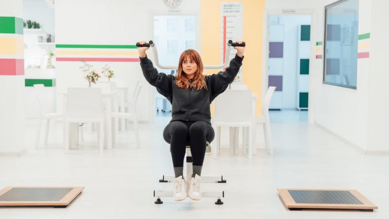 A woman exercising with weights indoors at a fitness facility in Yalova, Türkiye.